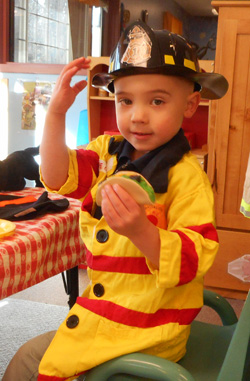 Boy in fire hat