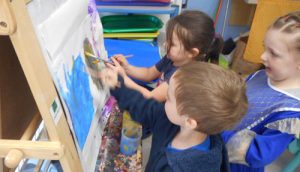 Kids at Paint Easel